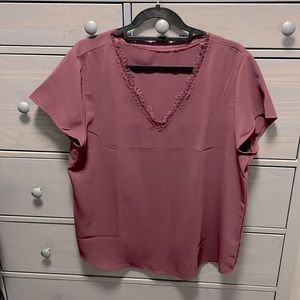 Maroon, short sleeve shirt with rustic v-shaped neckline.